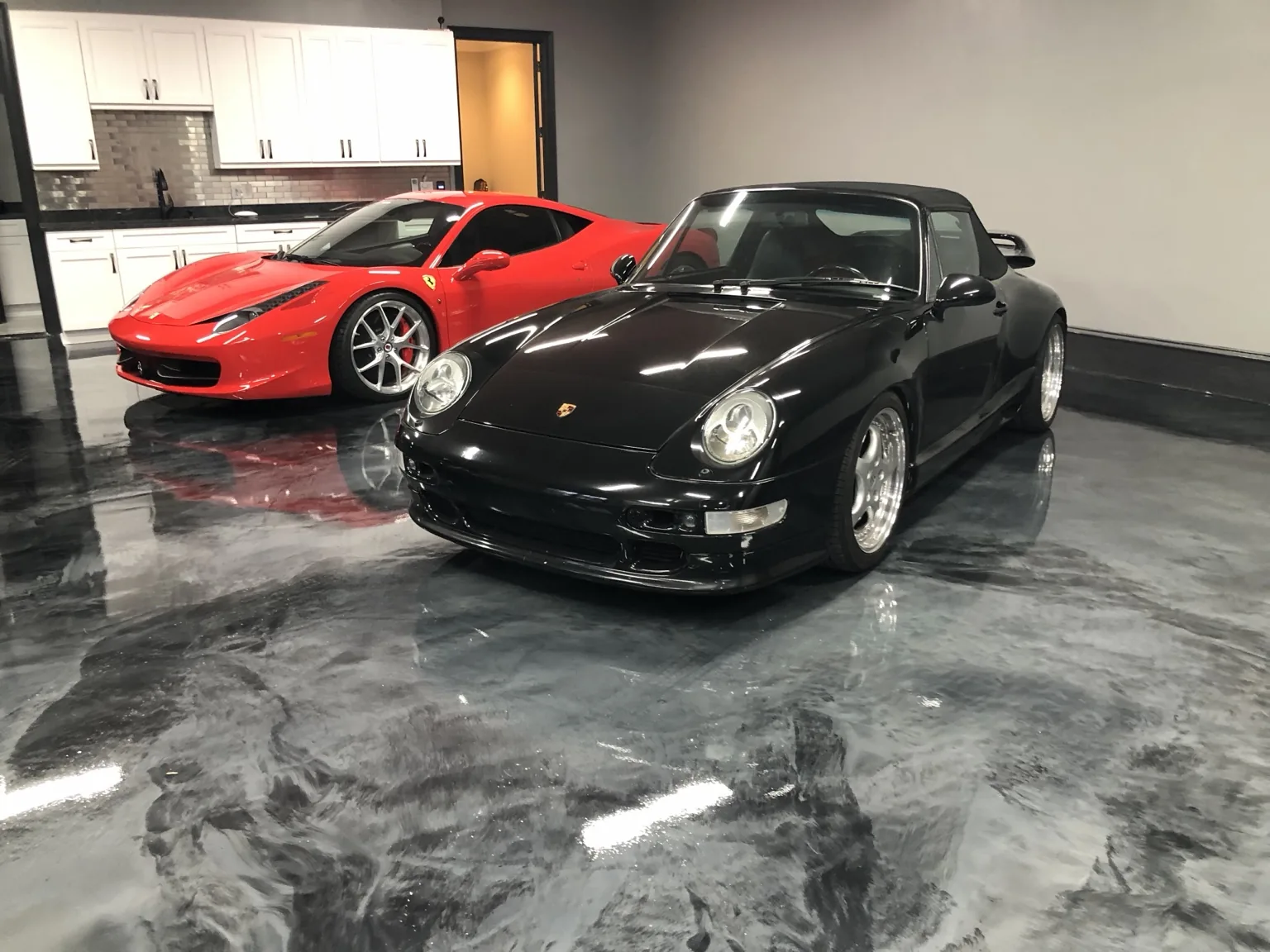 High-gloss gray metallic decorative floor in a luxury garage